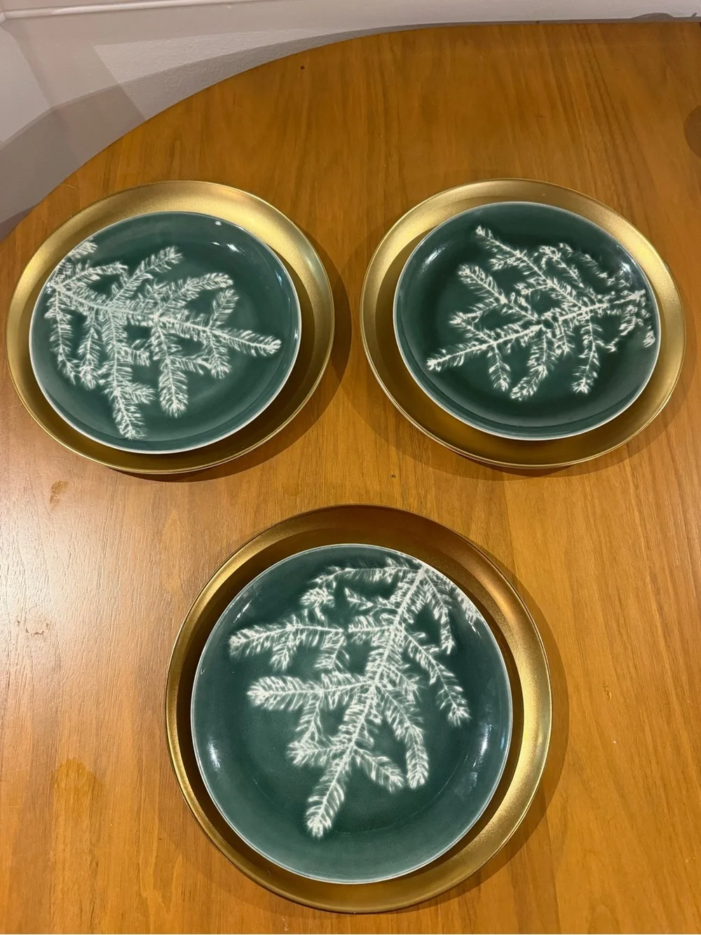 Set of three gold West Elm Plates